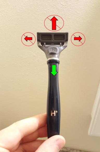 A razor with an arrow showing the correct direction of shaving, i.e. in the direction of the handle. There are other arrows pointing away from the handle and to either side that are labeled as the wrong directions.